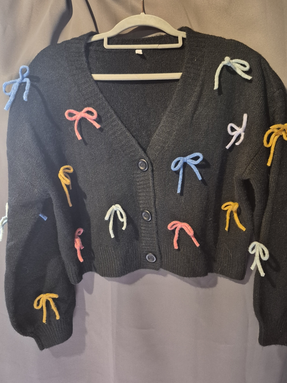 Black Cropped Button-Front Sweater with Multicolor Bow Accents